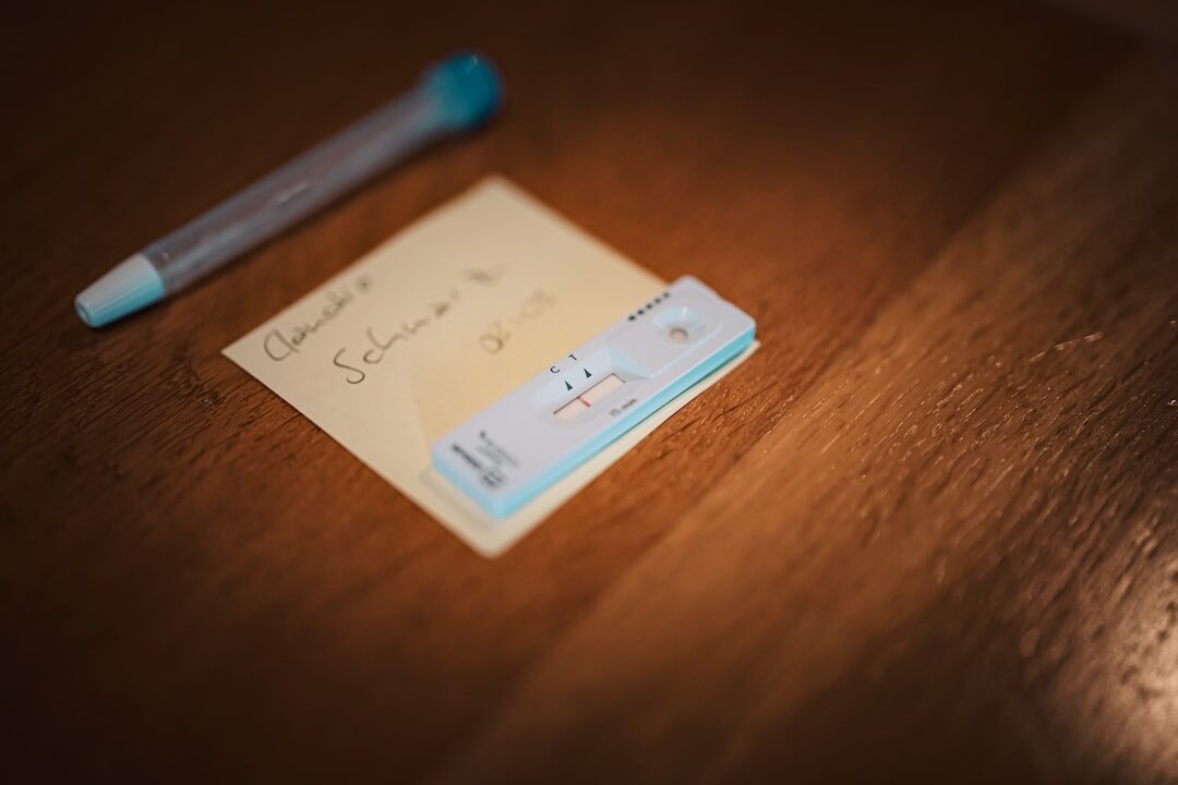 Overhead view of handwritten research notes, a fountain pen and coffee cup on a wooden desk
