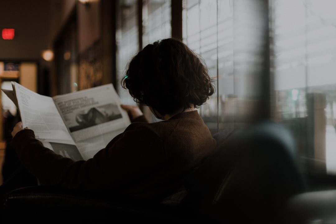 person reading newspaper