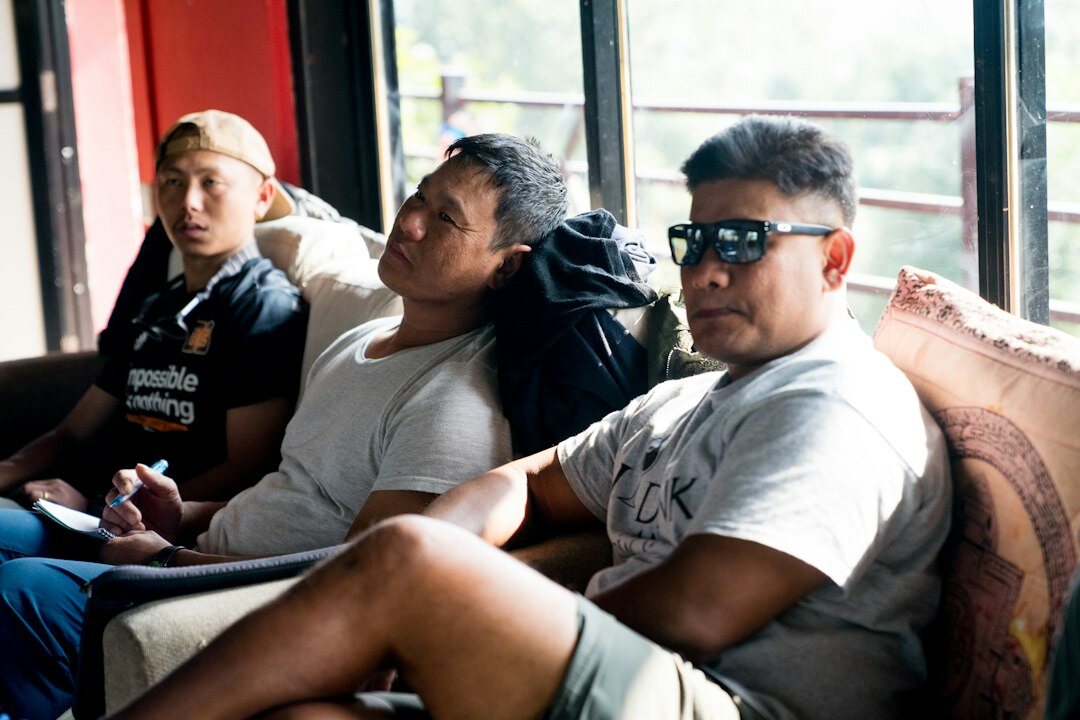 group of friends discussing on couch